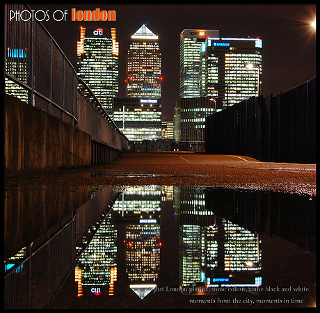 Canary Wharf skysrcapers reflected in a puddle
